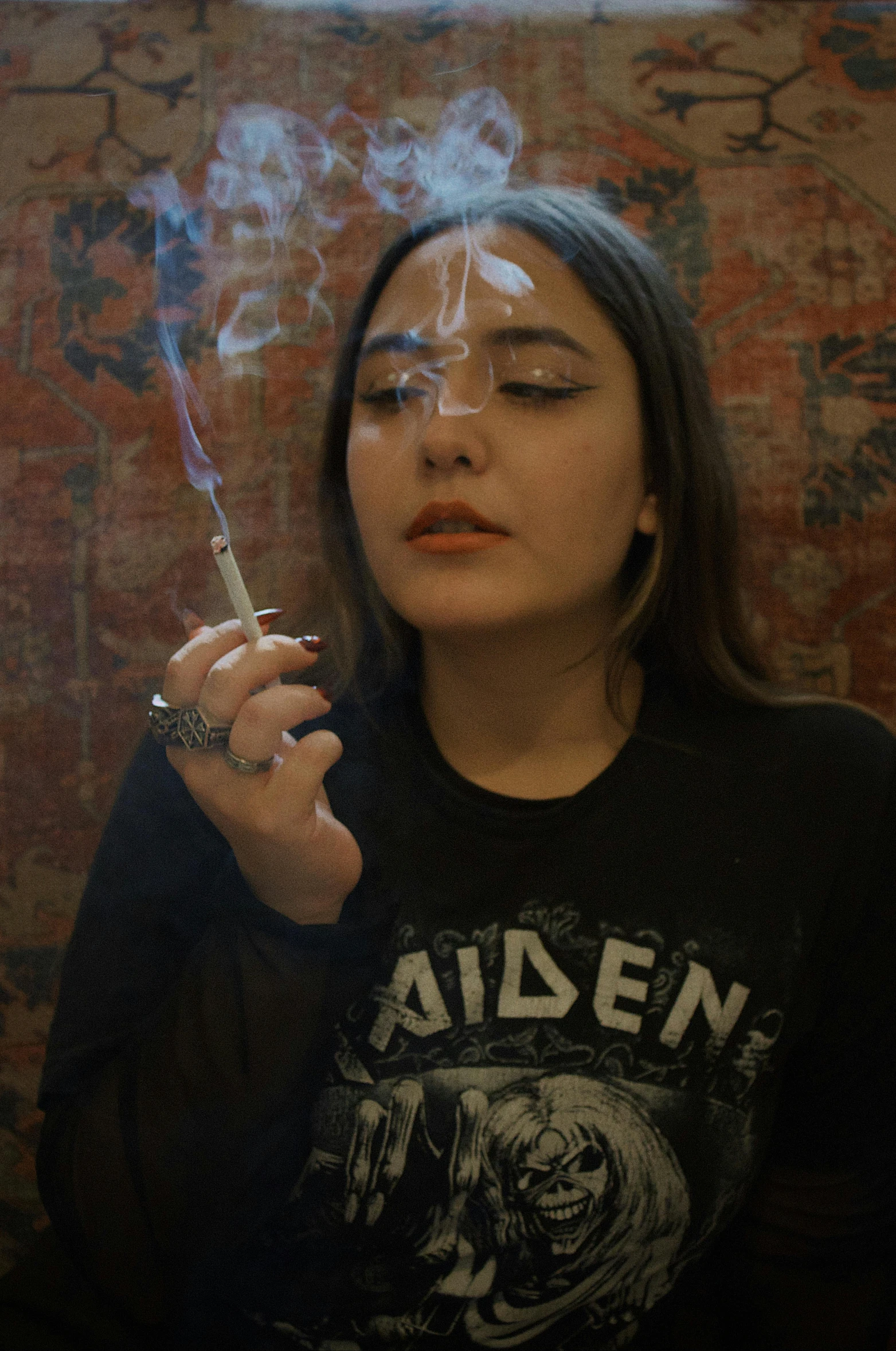 a young woman with smoke coming out of her mouth