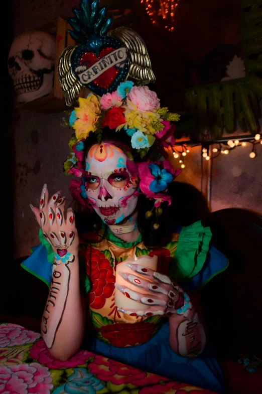 a woman dressed as a skeleton poses for a picture
