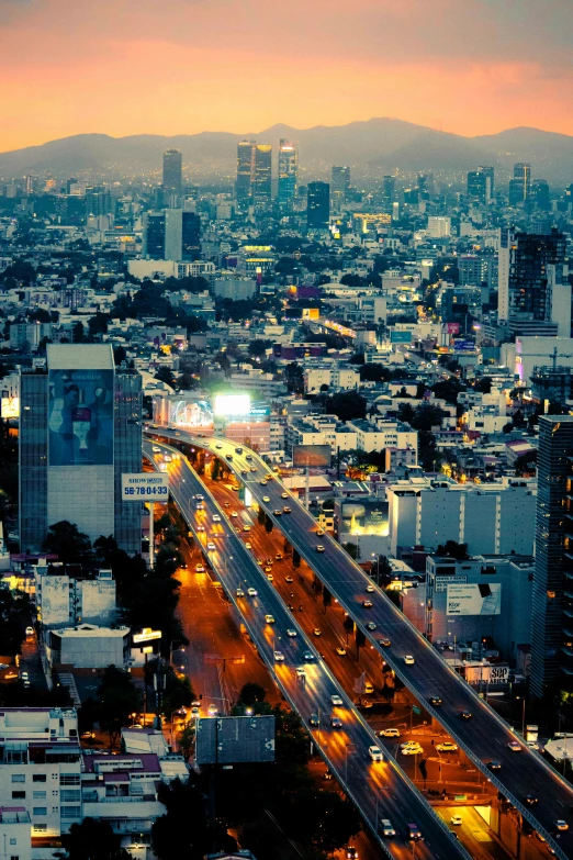 an overview of the city at night with lots of traffic