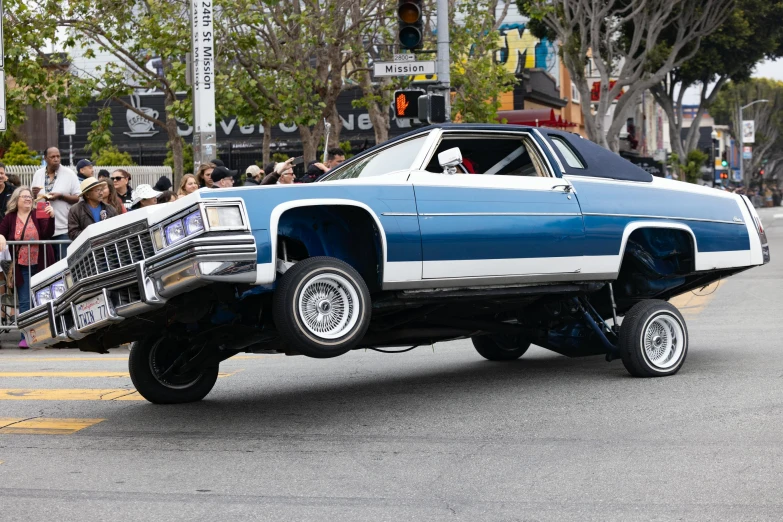 an automobile with its flat bed is driving on the street