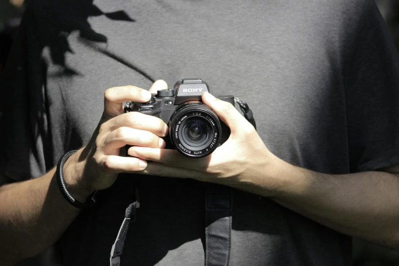 someone holding a camera that is being reflected