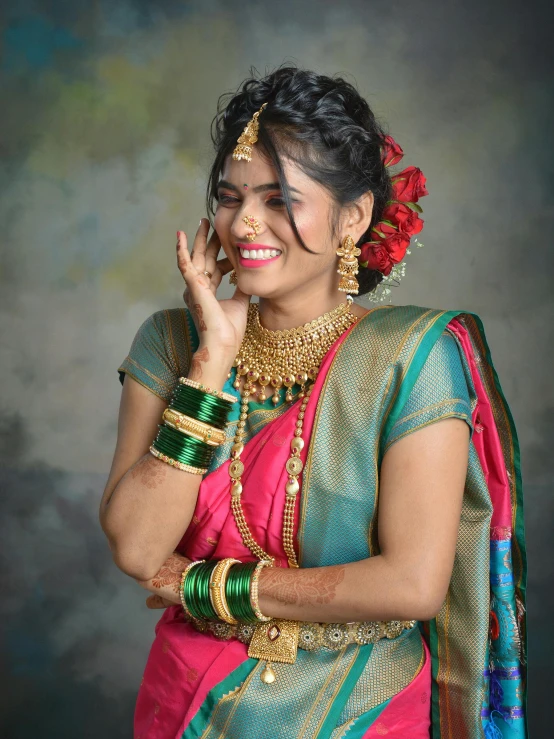 a woman with an indian style outfit wearing head piece