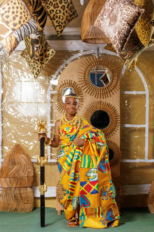 a woman standing under a huge animal print umbrella