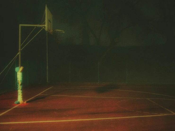 a man who is standing on a tennis court with a racket