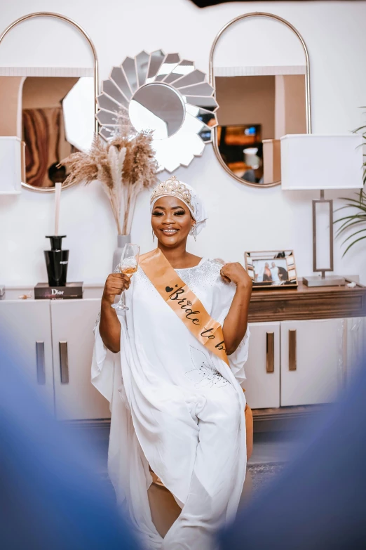 a woman wearing a tiara is posing for a po