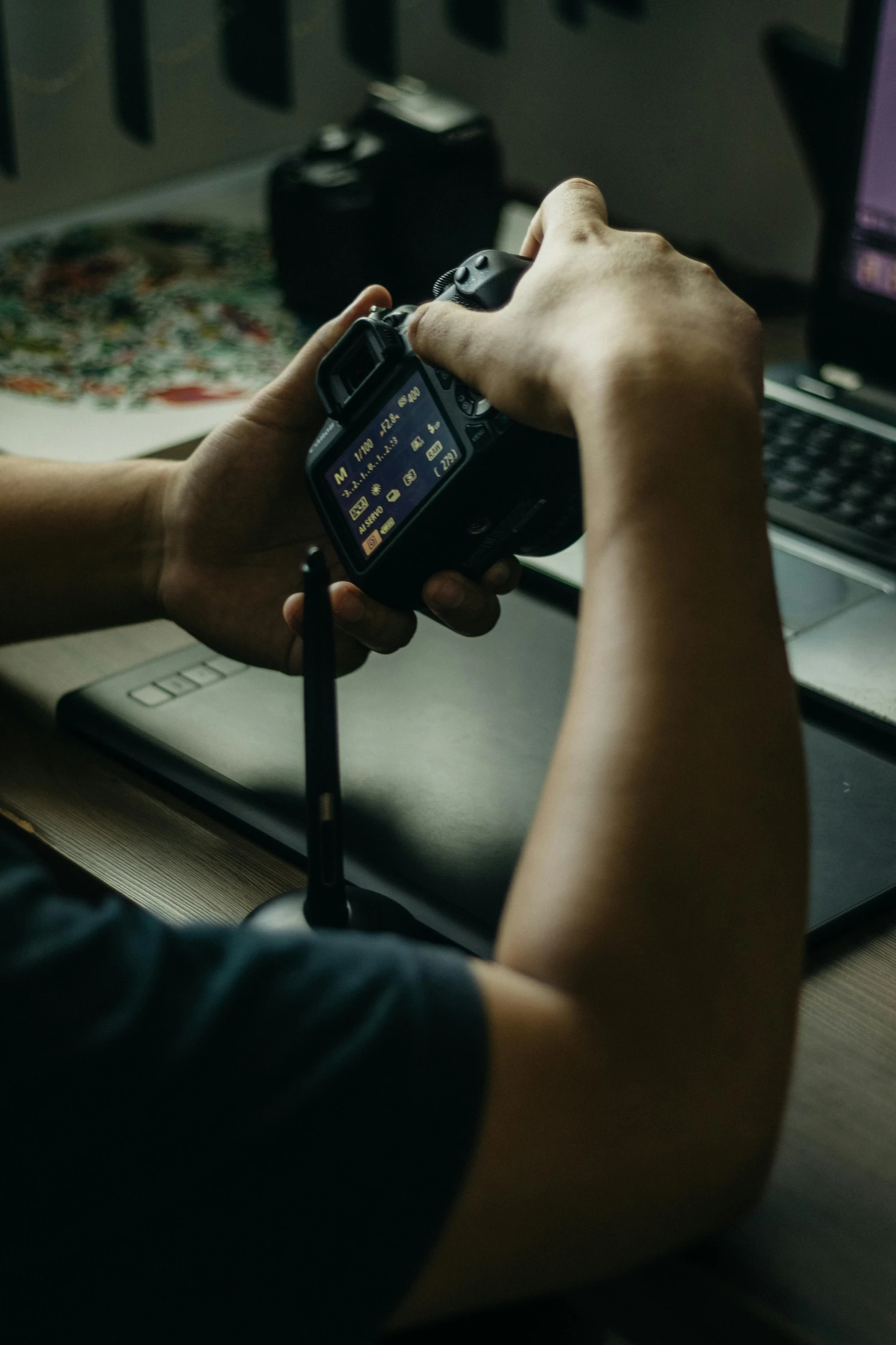 a person is using their cellphone to view images on the computer