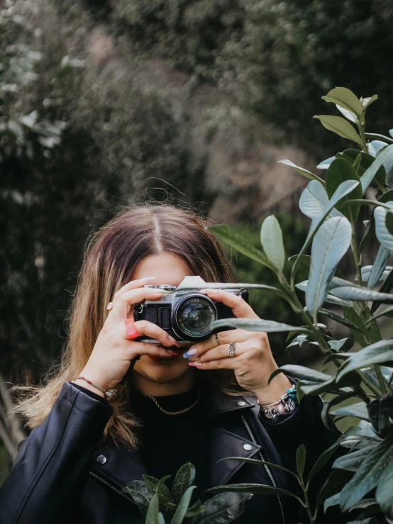 a woman taking a po of herself with her camera