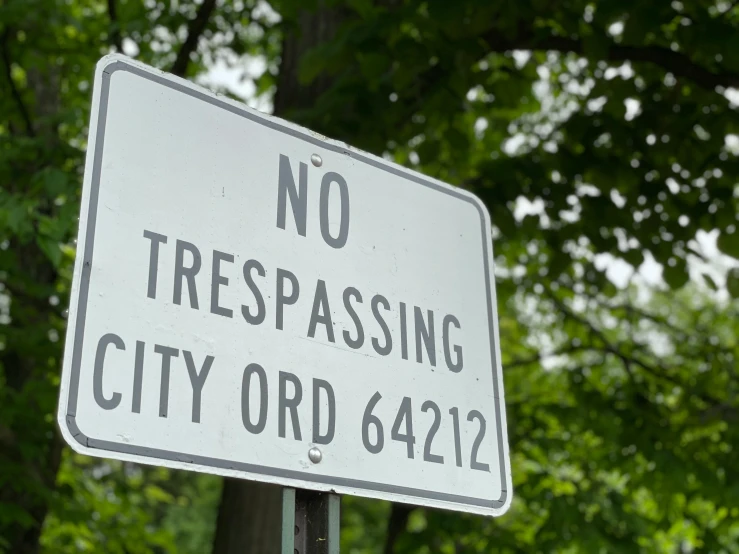 no trespassing city street sign at green park