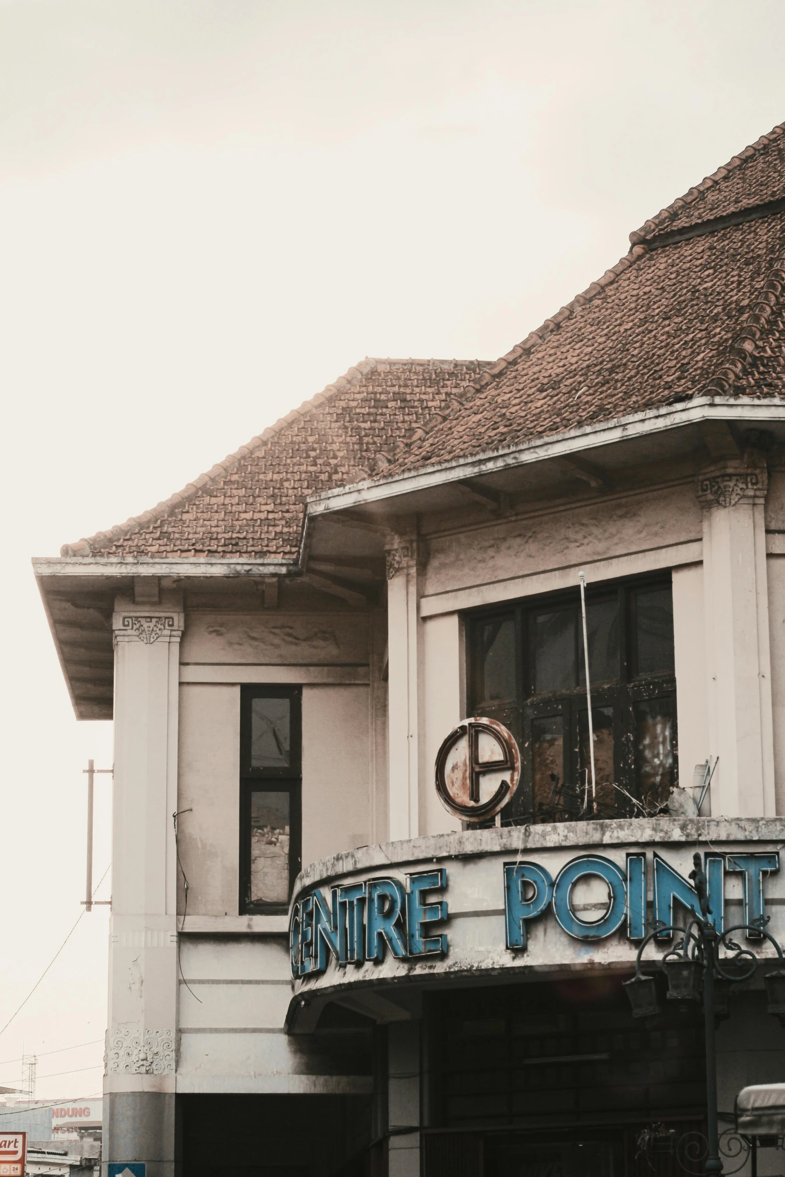 the entrance to a restaurant with a pointed roof