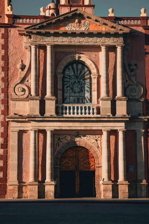 there is a clock tower at the end of this building