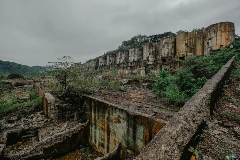 an abandoned structure stands in a rocky mountain