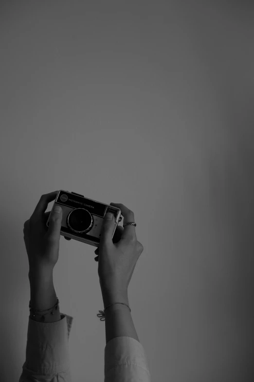 a person that is taking a picture with a camera