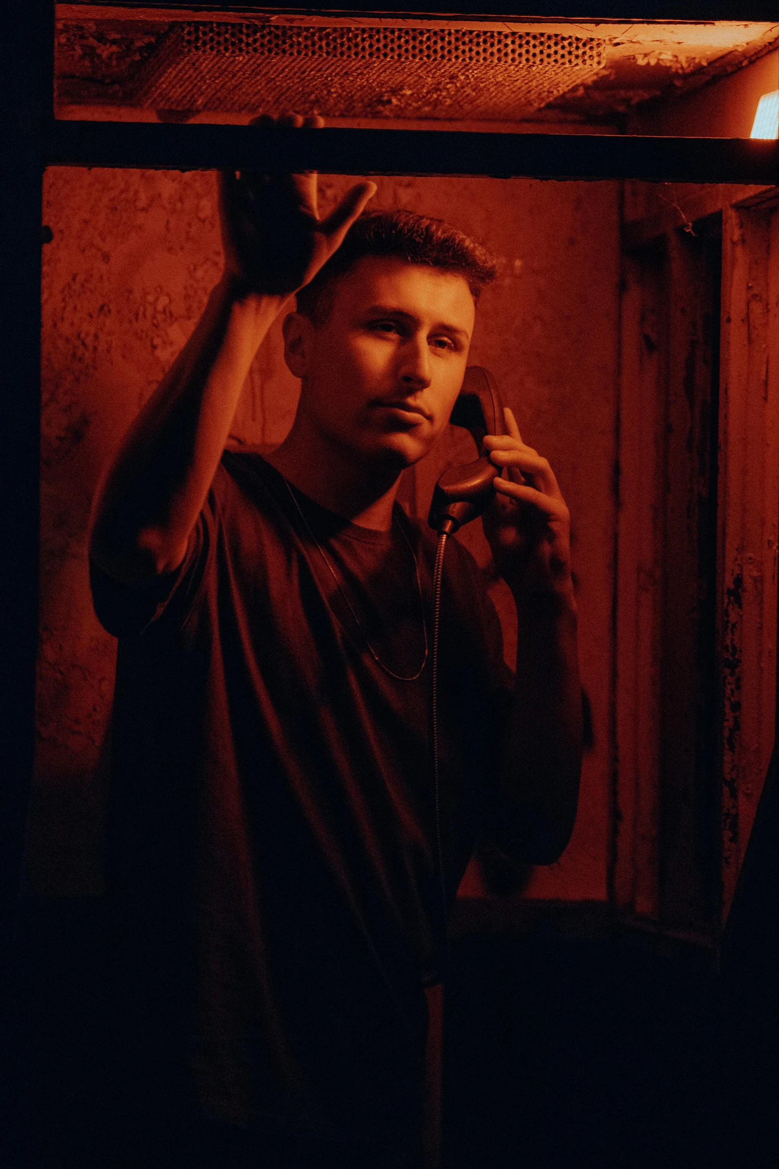 a young man in the bathroom brushing his hair