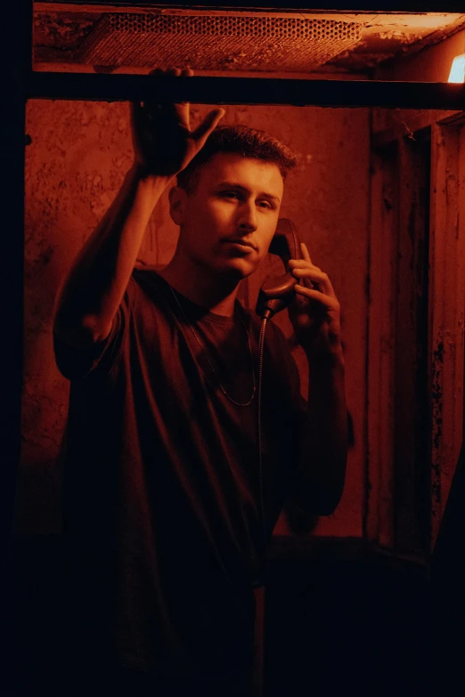 a young man in the bathroom brushing his hair