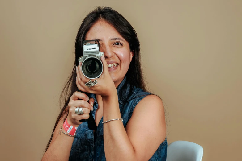 a woman taking a picture with a camera