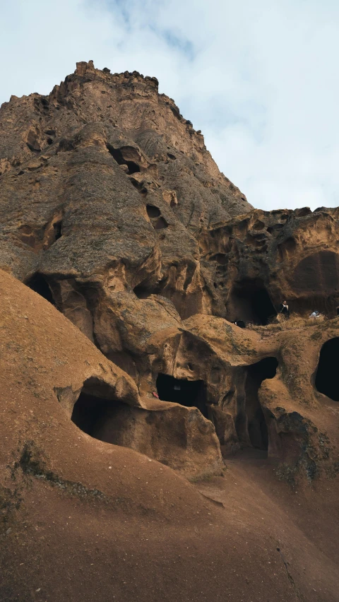 a mountain that has some rocks near by