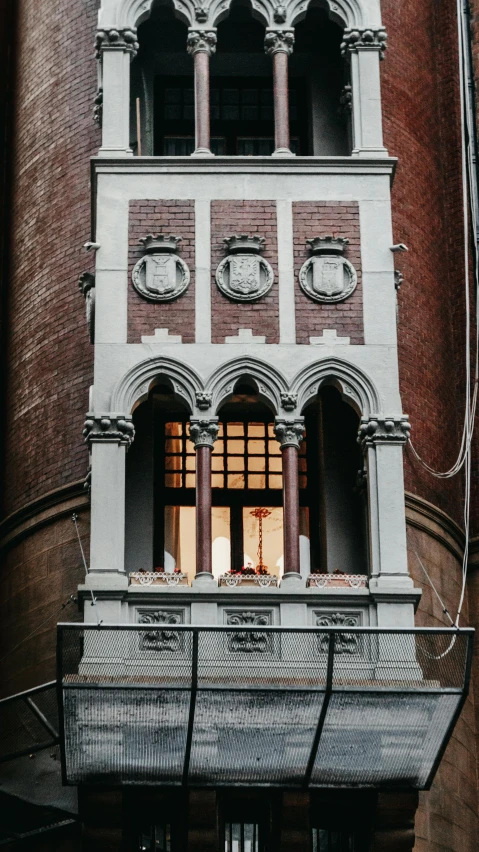 an ornate, white and red building that has many windows