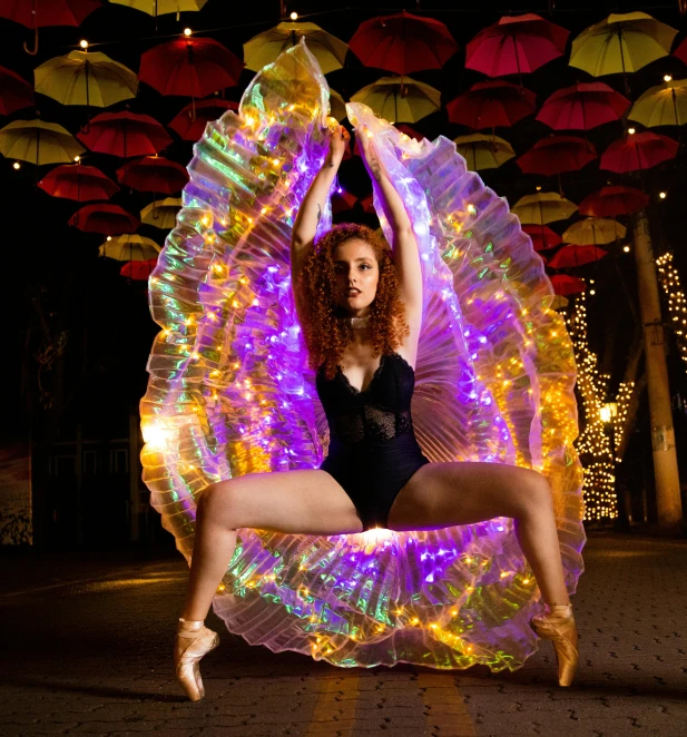 a woman is posing for the camera in front of some decorations