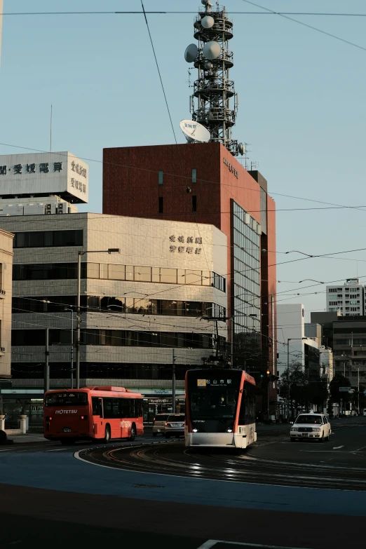 city scene with traffic and large tower in the distance