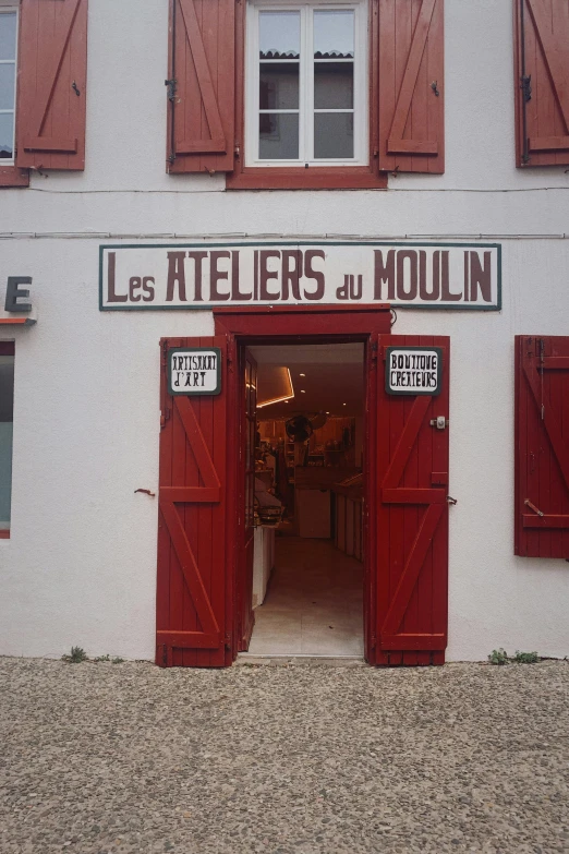 the door is open to a french restaurant