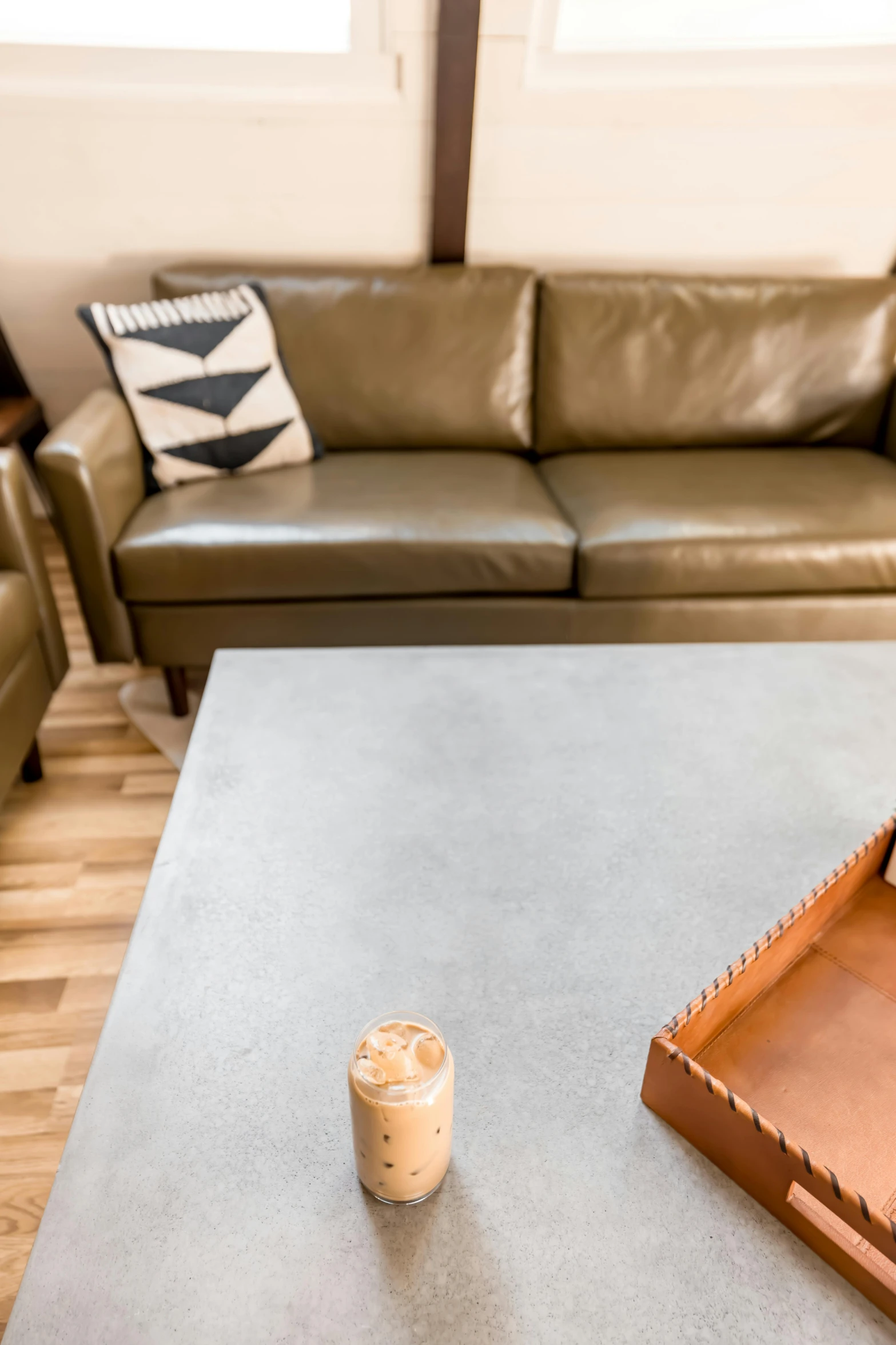 a coffee table with a tray and wooden container in it