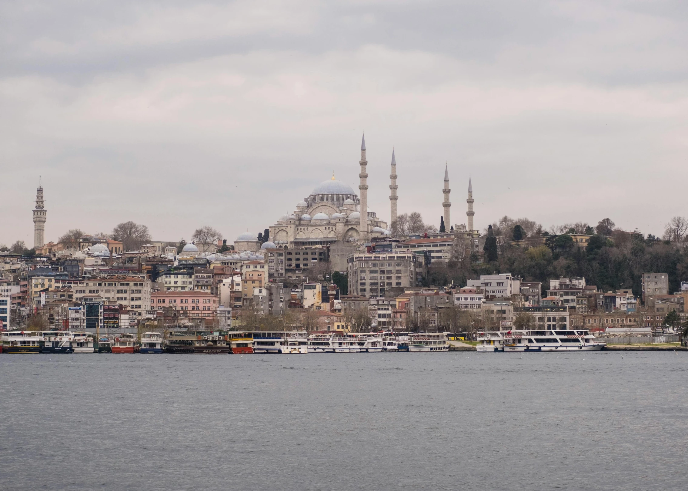 a view of the city from the bay of a large body of water