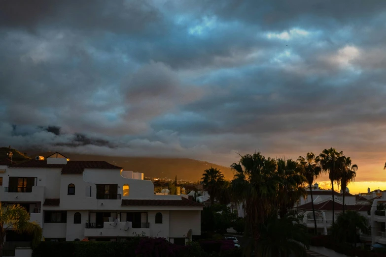 clouds loom above a residential area in california