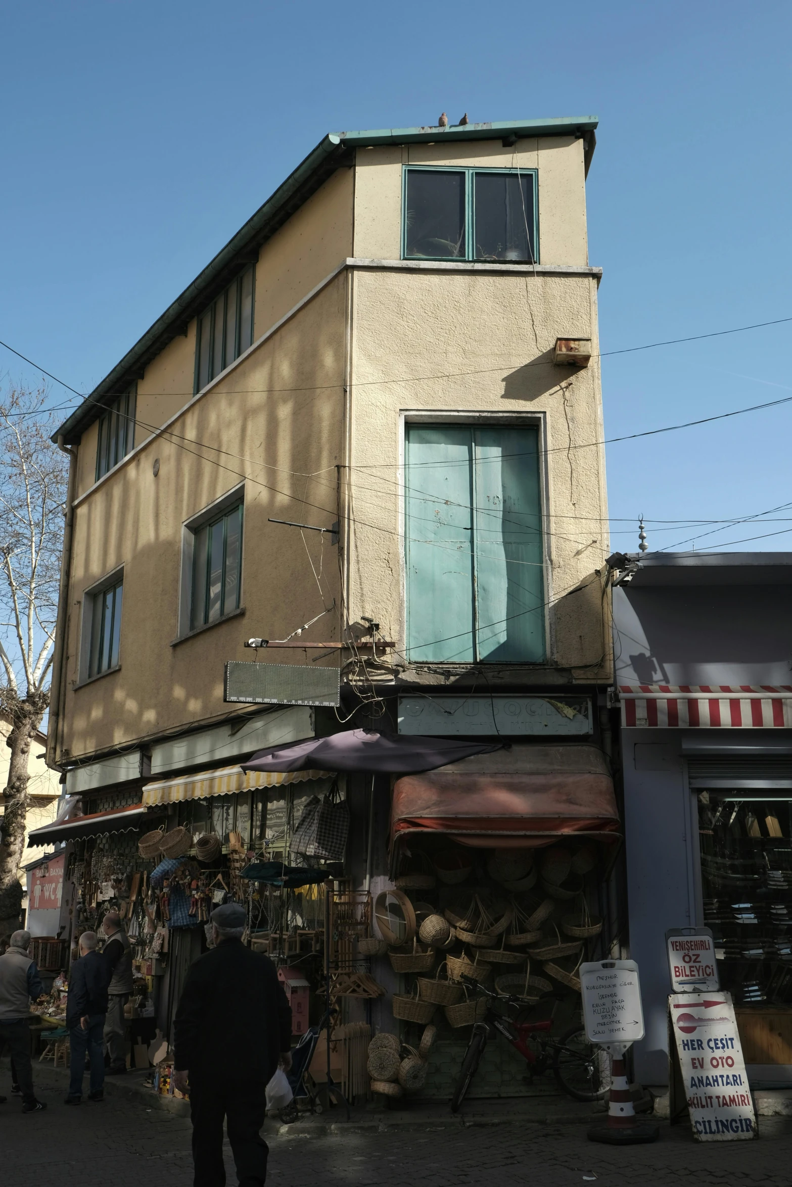 a group of people walking around outside of a building