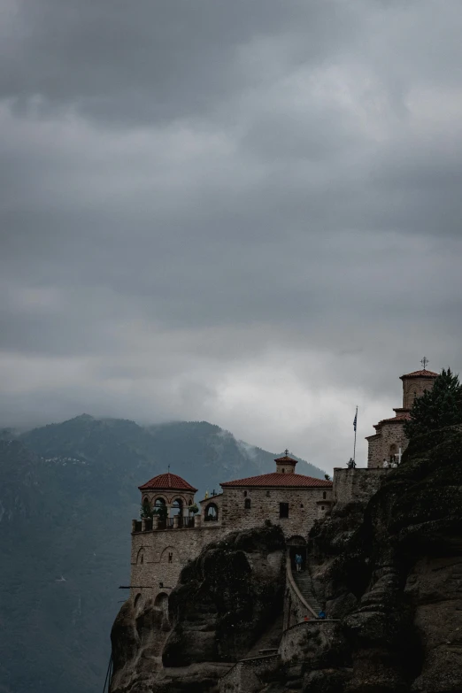 a rock outcropping is shown with a castle on it