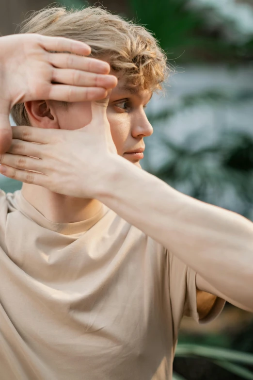 the man is adjusting the woman's earrings