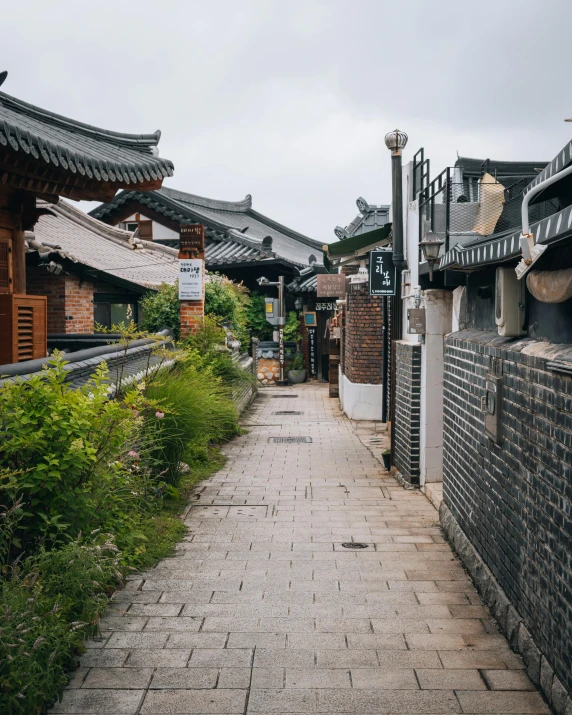 narrow road in an ancient chinese setting with brick buildings