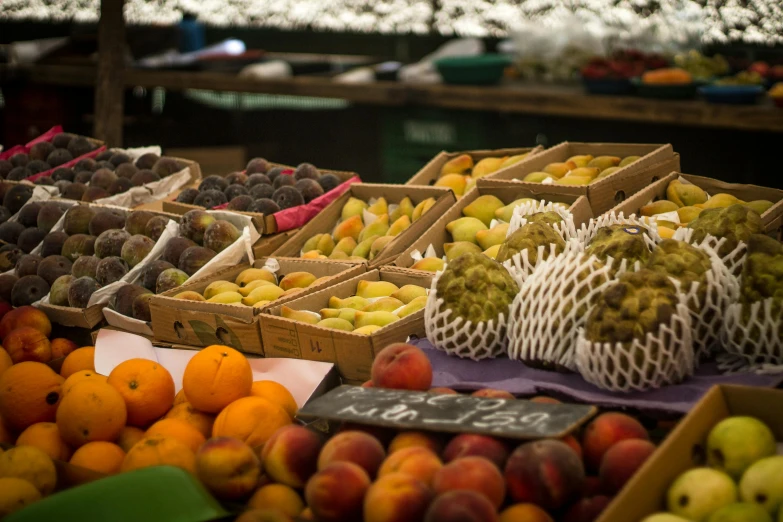 assorted fruit on a farmer's market with different price tags