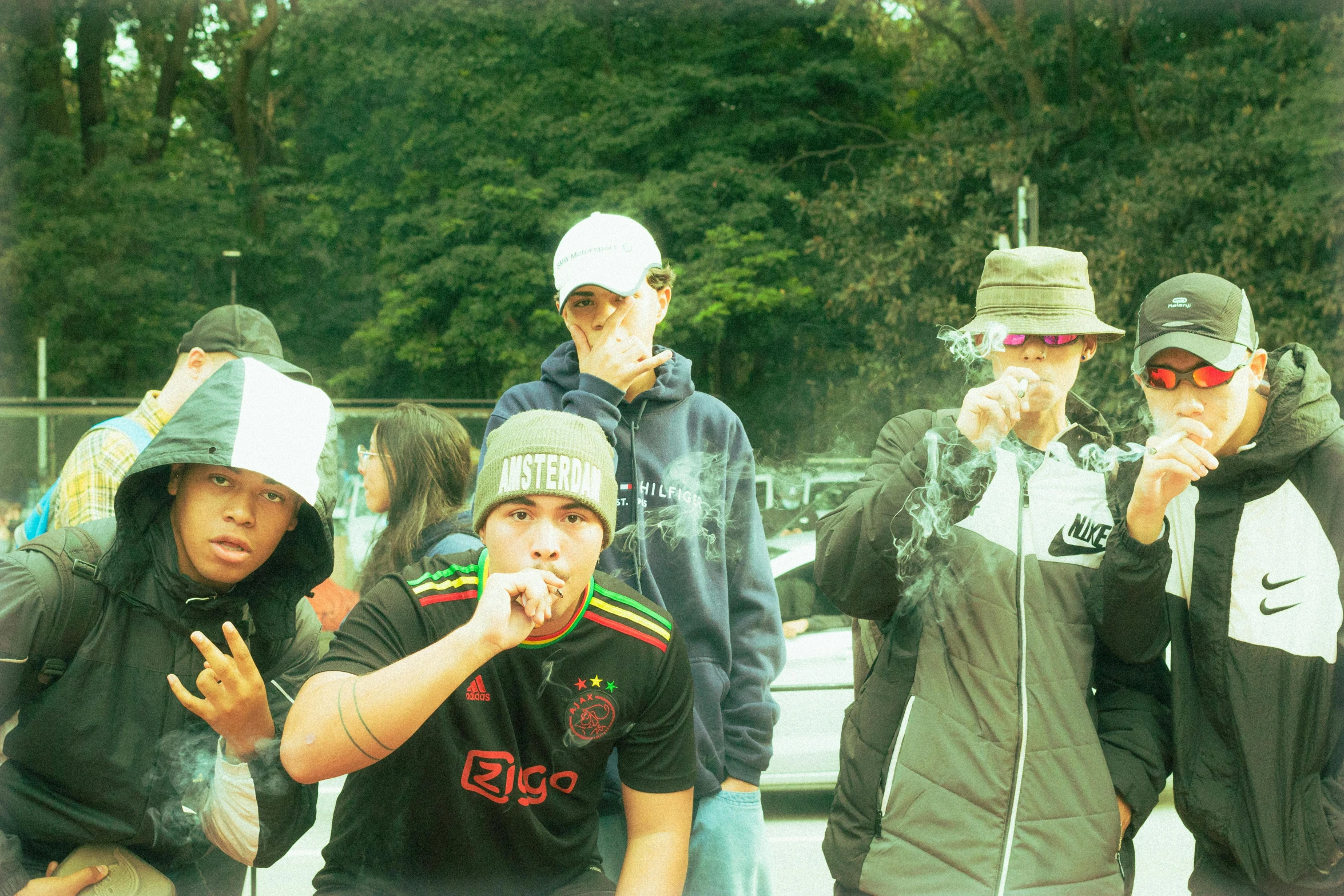 group of people in hat standing around each other