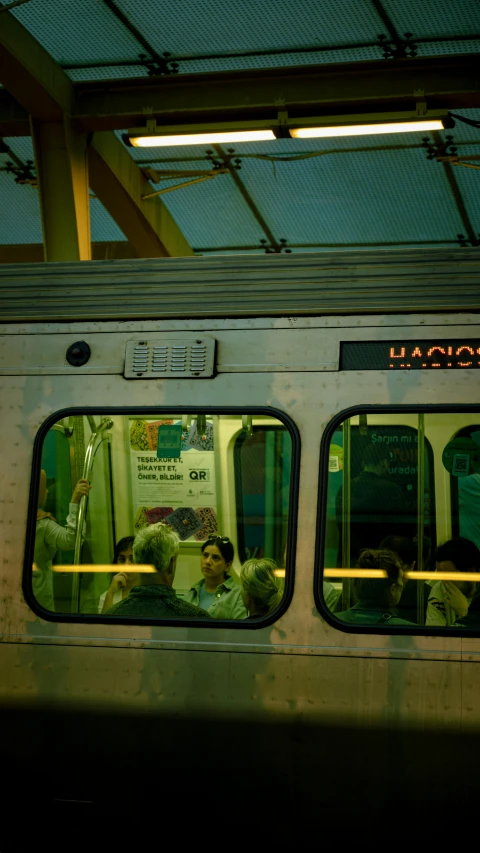 passengers are seated in an empty train car