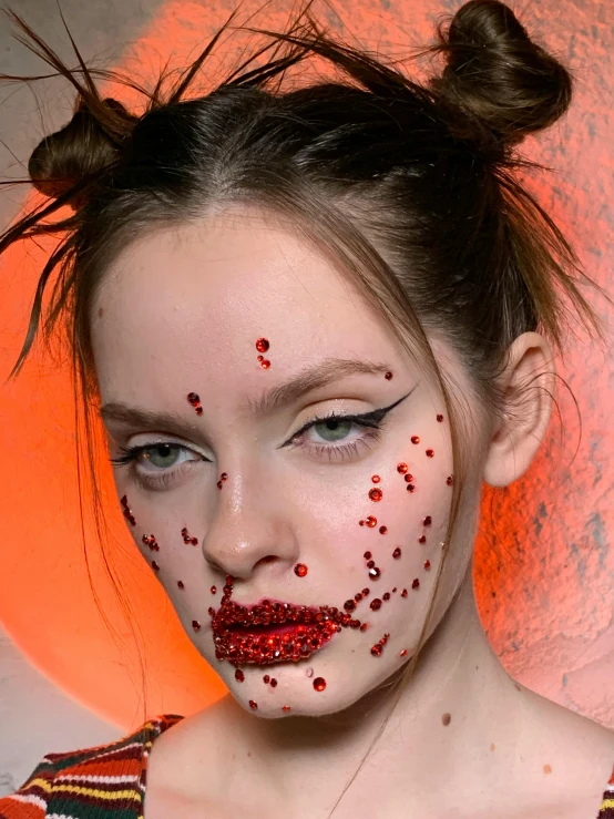 a woman is posing with a makeup creation