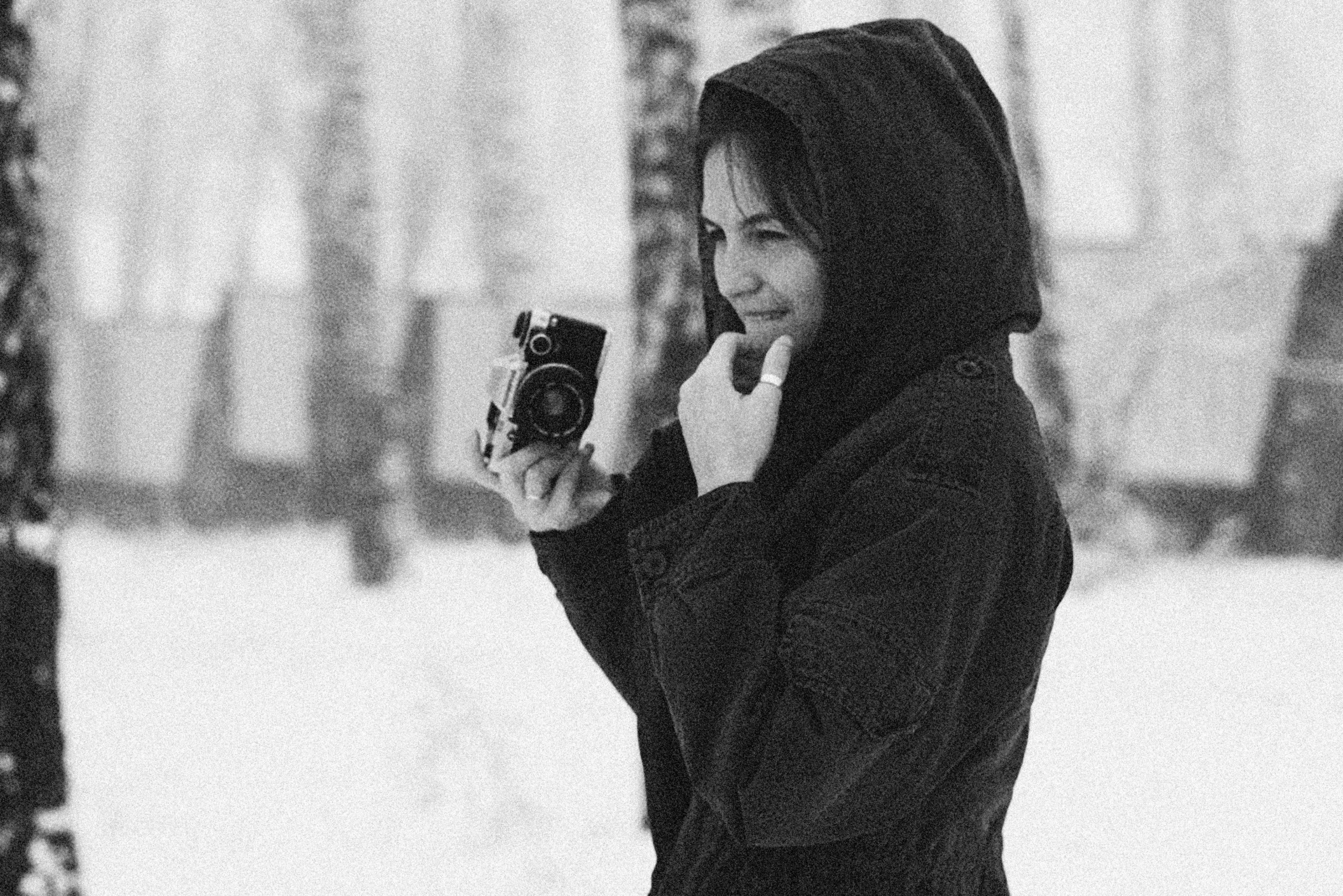 a black and white po of a woman talking on a cell phone