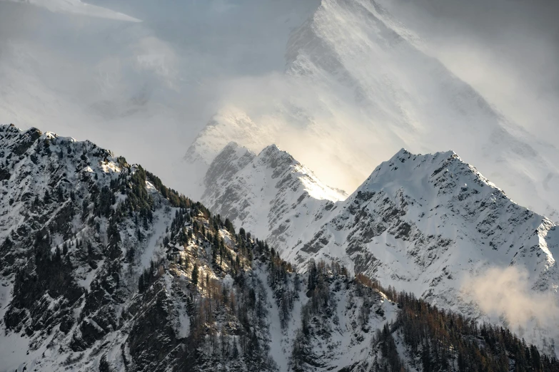 mountains covered in snow in the sunlight