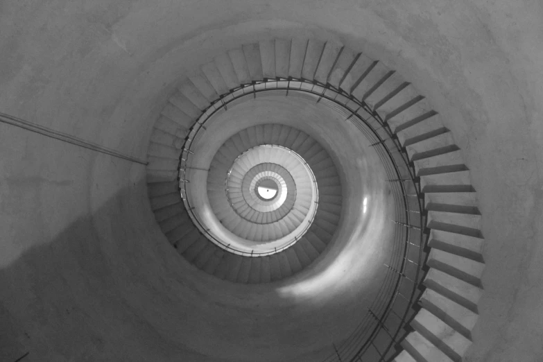 a stairway with spiral stairs going through the center