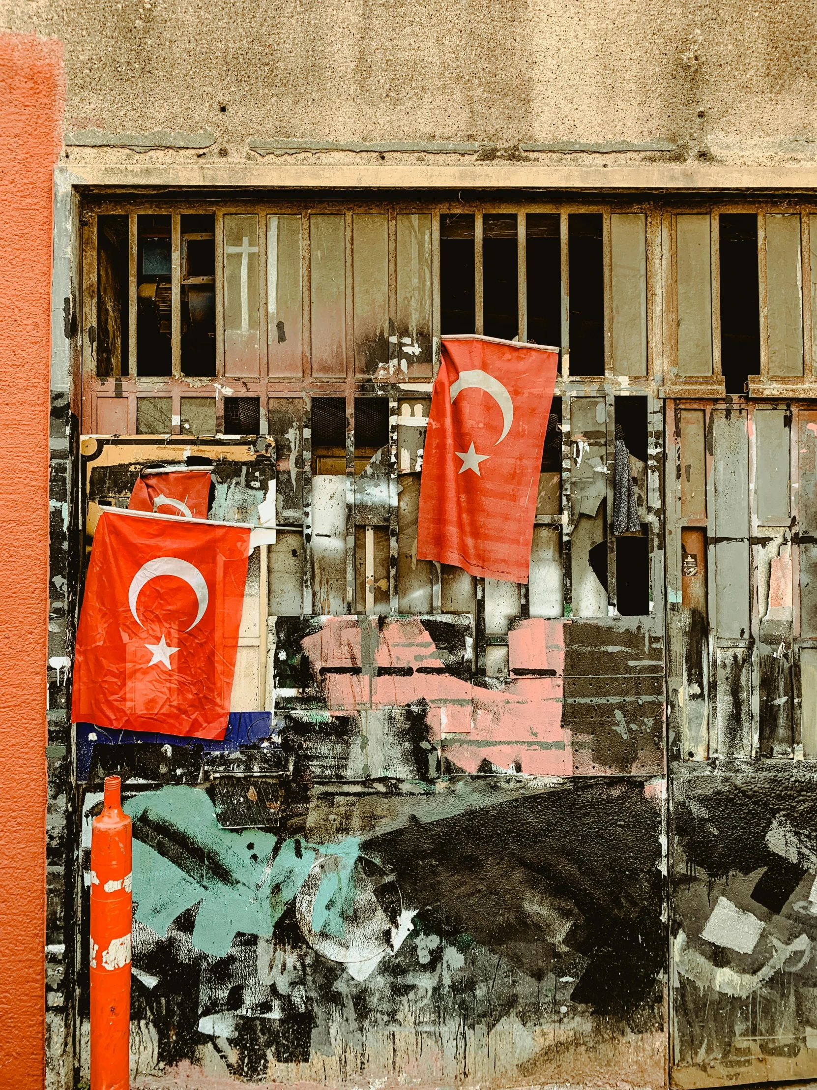 turkey - style flags hang from old windows