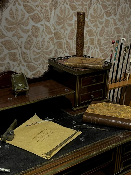 old fashioned desk with chair, phone and papers