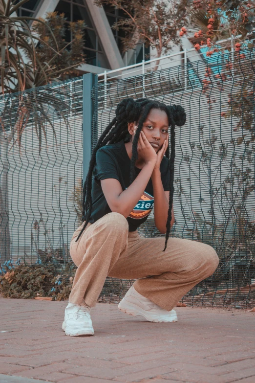 a girl leans to her side on a skateboard