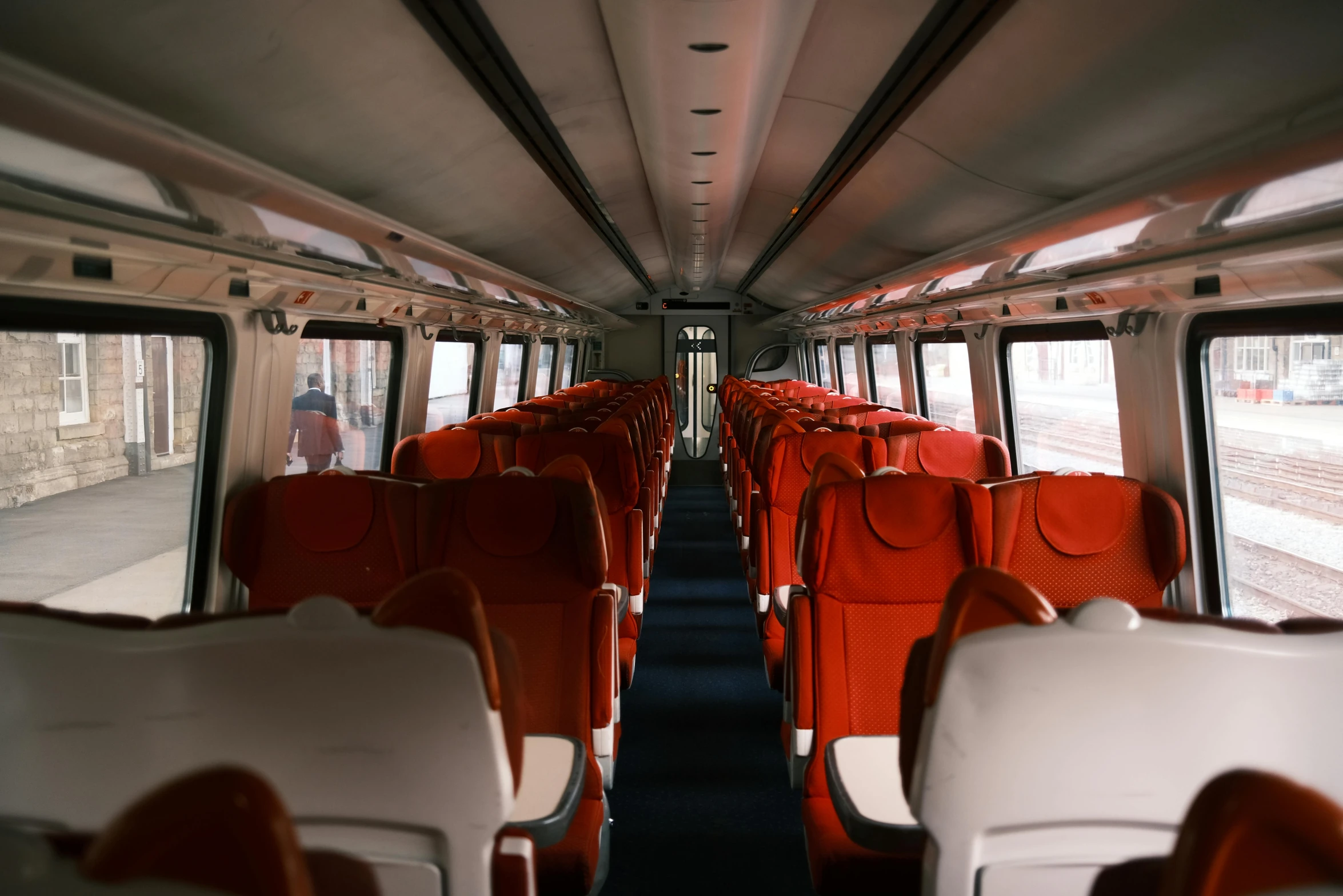 an empty bus with lots of seats inside