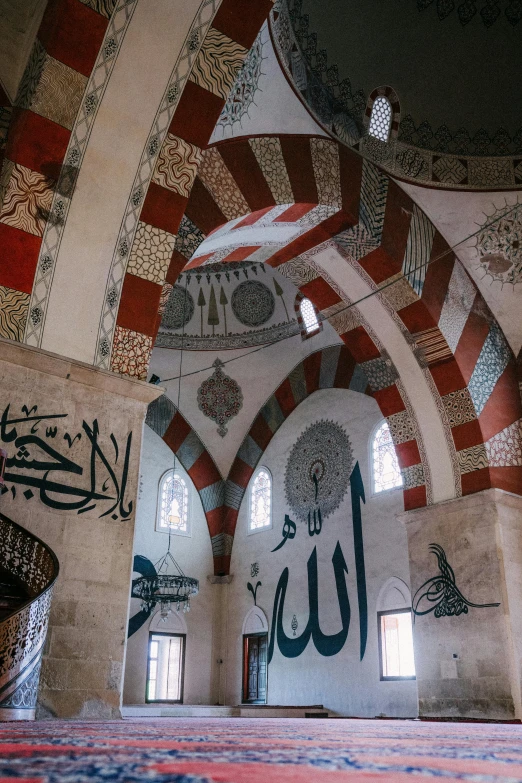 the ceilings and windows in this building are decorated with islamic writing