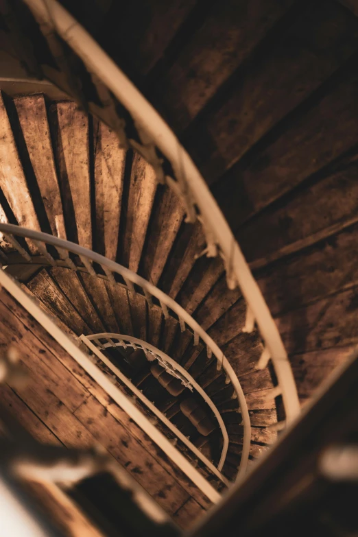 a view up inside of an old spiral staircase