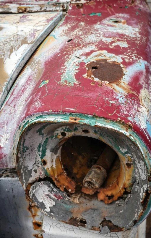 an old metal pipe with rust on it