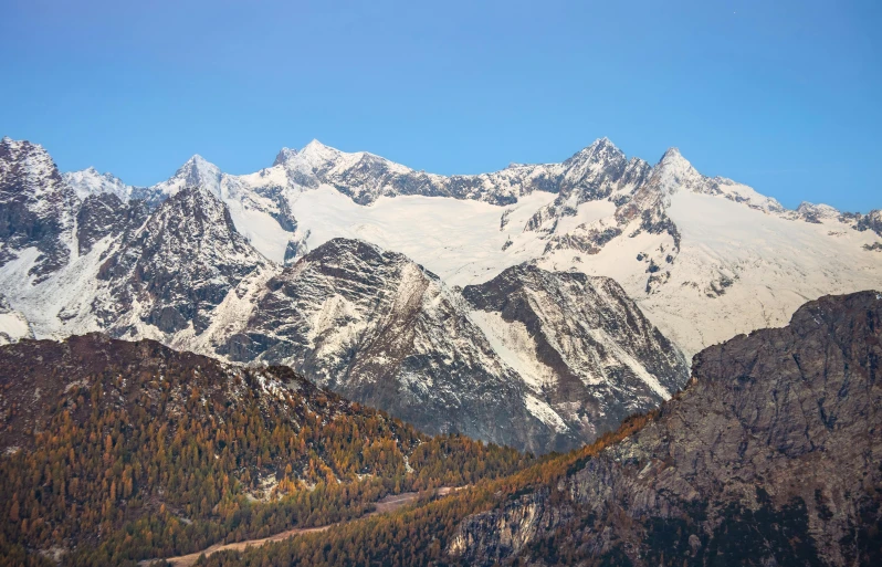 a view of mountains from a hill top