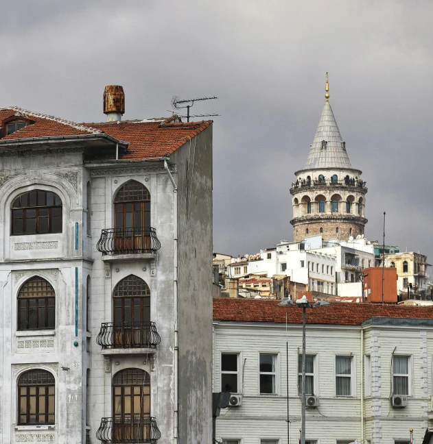 the two buildings have very large windows with some roof tops