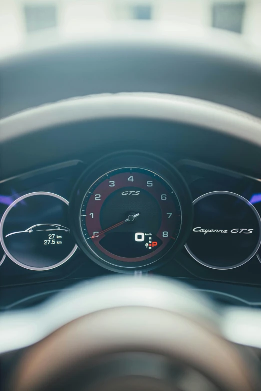 the dashboard of a car with four gauges