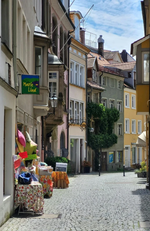 several tables are lined up on the street