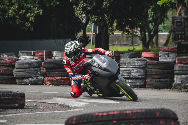 a person riding a motorcycle down the road